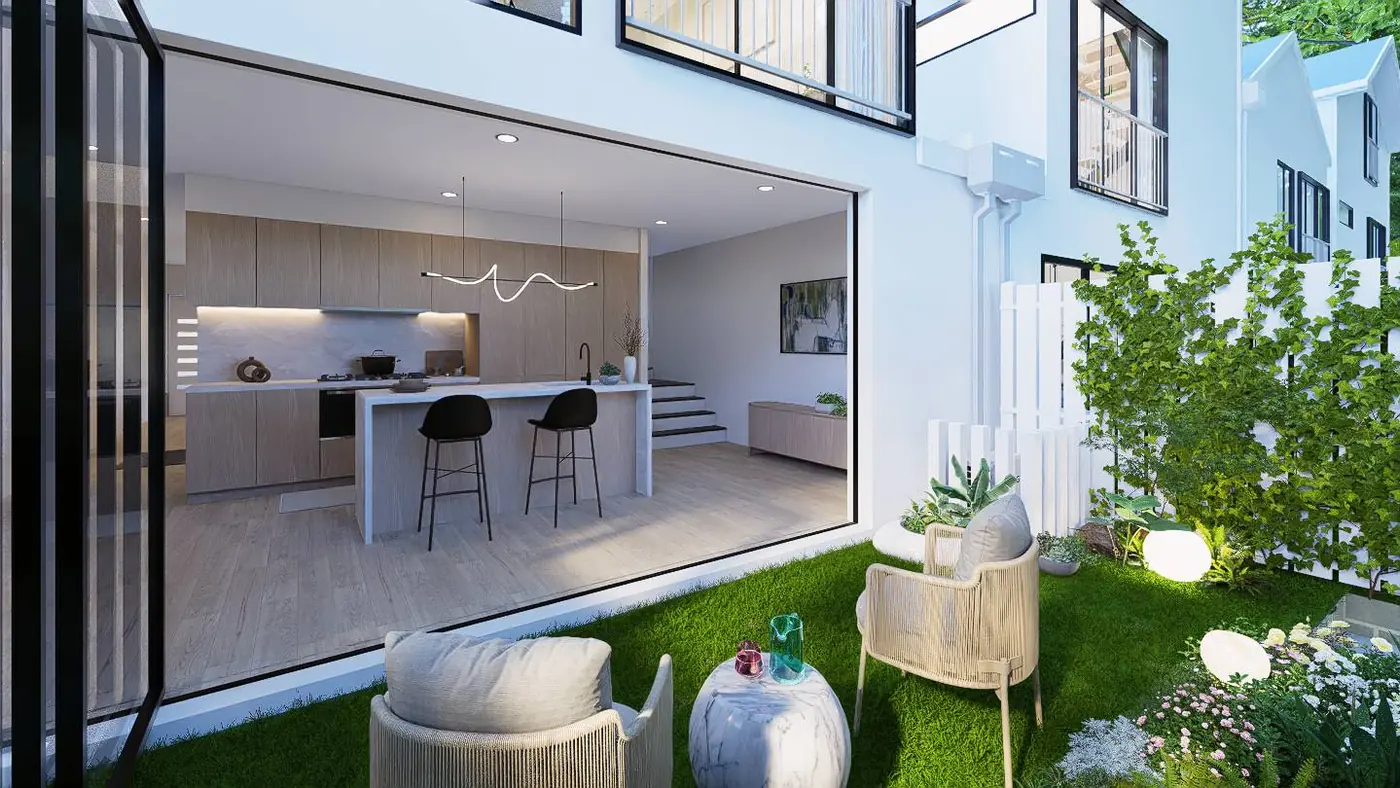 Full-height stacker doors opened from the kitchen and living area onto a planted courtyard with lawn and lounge seating.
