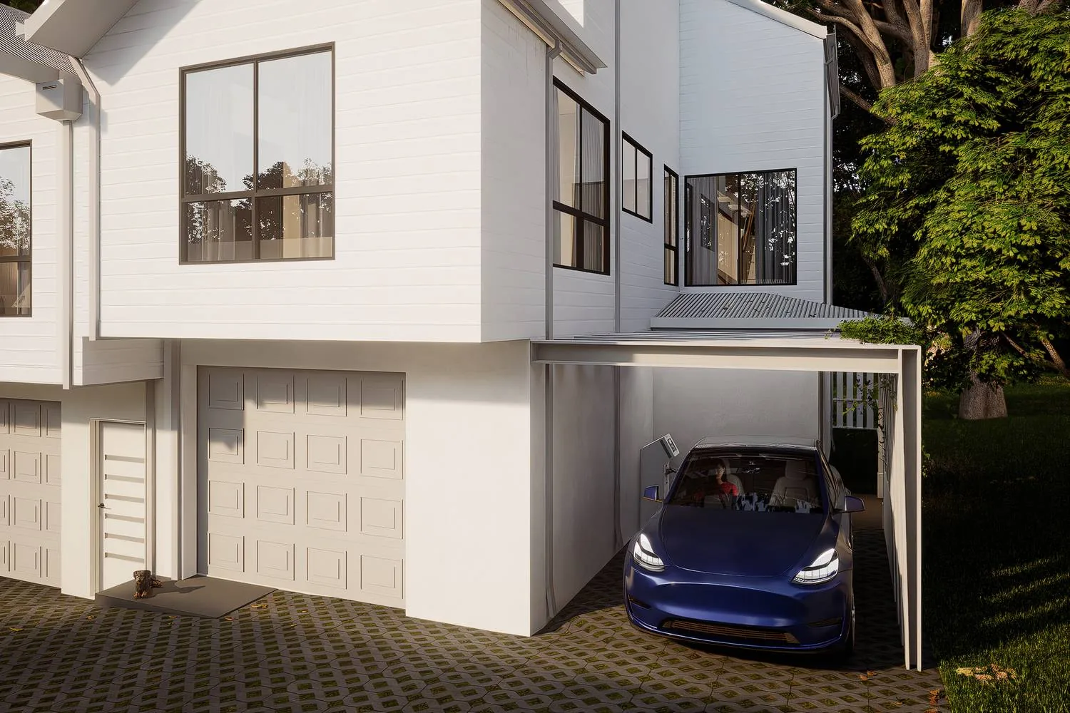 An electric car parked in a covered garage bay beside a permeable green driveway.